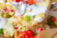 Loaded Cauliflower Nachos with Cheese, Salsa & Avocado