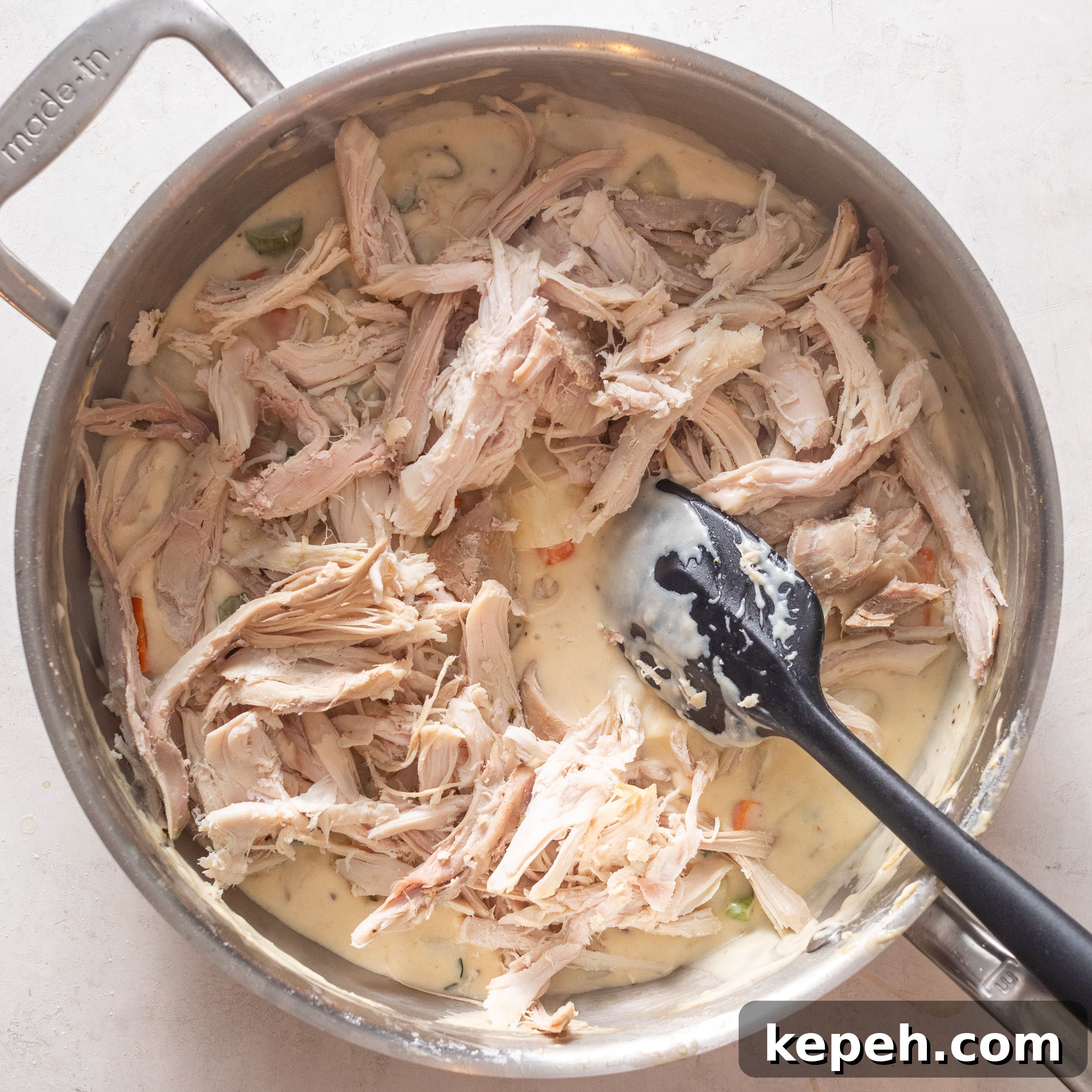 Leftover Turkey Pot Pie Recipe for Comforting Family Meals 8 Adding turkey and peas