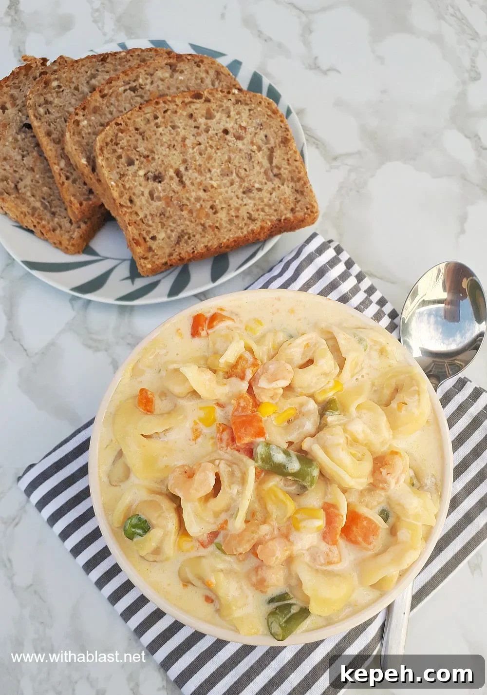 Creamy Shrimp Tortellini Soup is packed with vegetables, so filling and so comforting - ready in about 30 minutes Creamy Shrimp Tortellini Soup