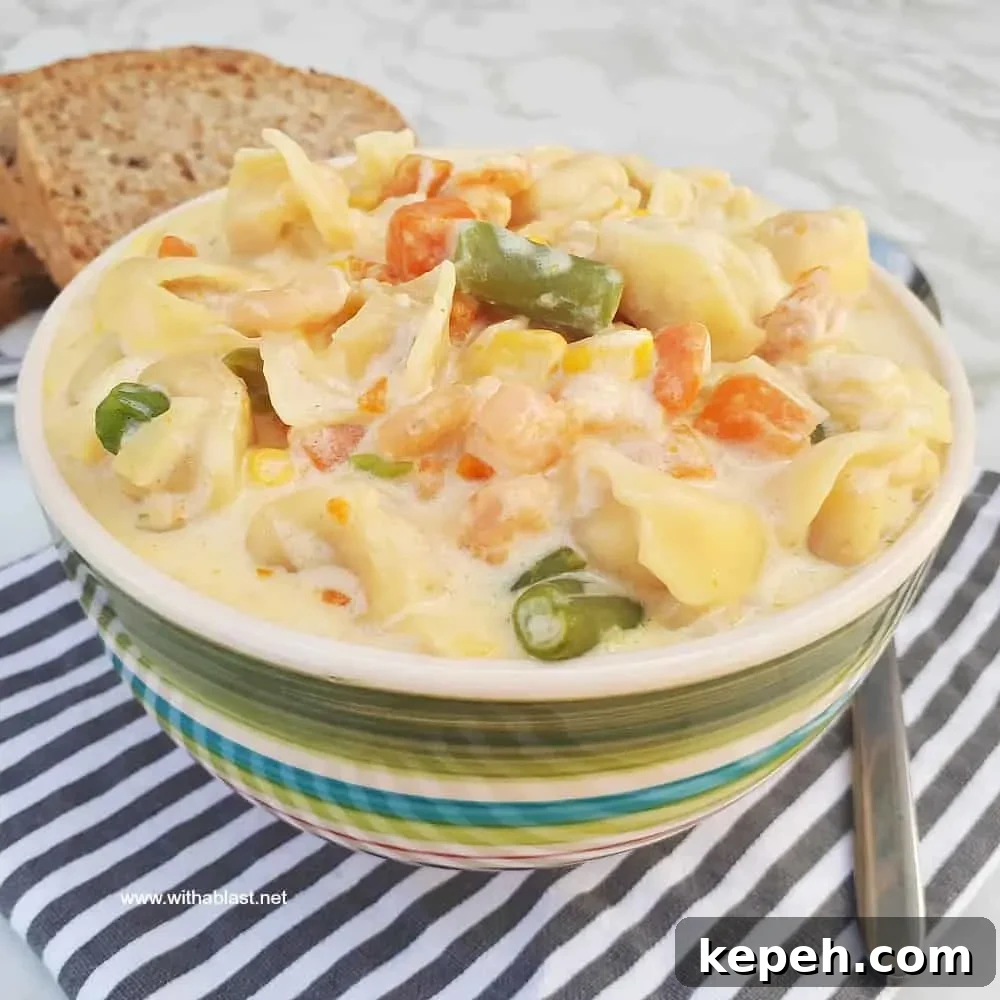 Creamy Shrimp Tortellini Soup is packed with vegetables, so filling and so comforting - ready in about 30 minutes Creamy Shrimp Tortellini Soup