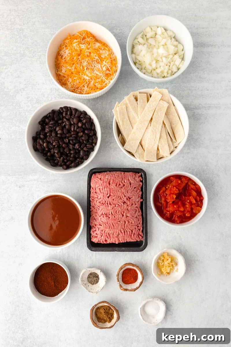Ingredients for ground beef skillet enchiladas in small bowl on counter.