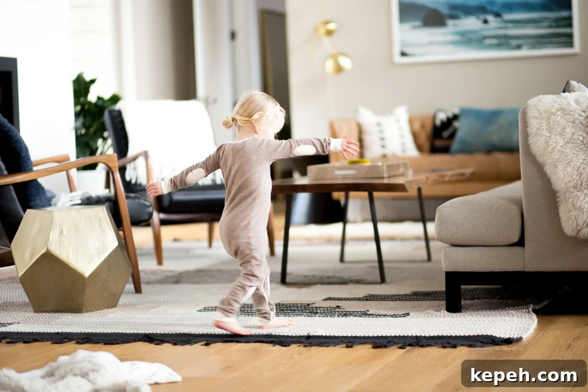 small girl dancing at home in pajamas