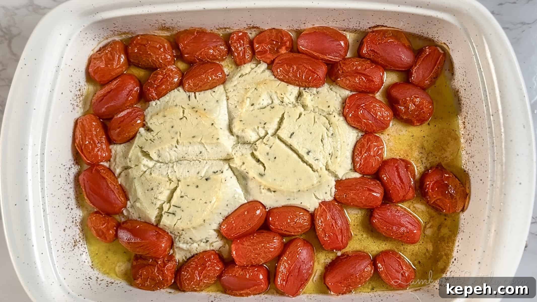 Creamy Boursin Pasta with Garlic and Herbs 5 cheese and tomatoes in a casserole dish after baking.