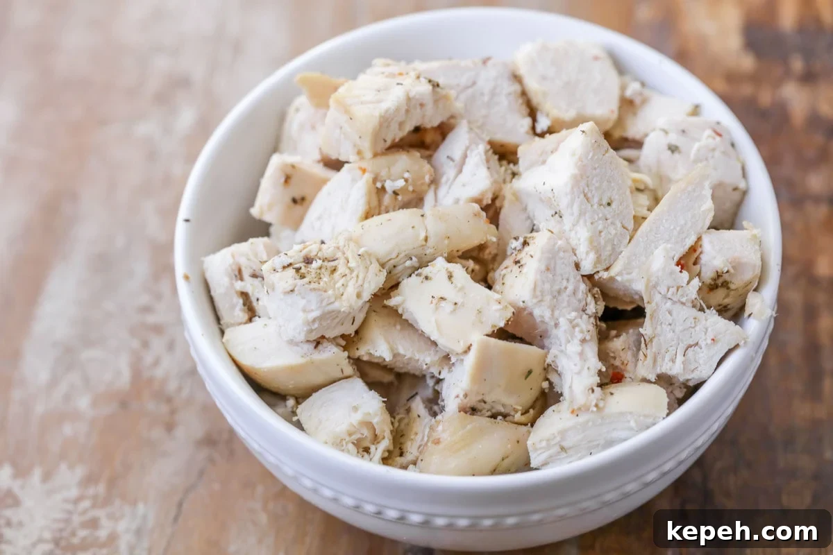 Classic Chicken Divan Casserole Recipe for Family Dinners 2 Cubed chicken in bowl for Chicken Divan recipe.
