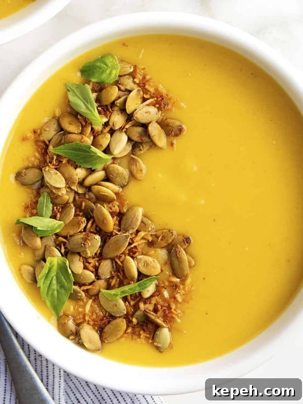 Creamy Tomato Bisque Recipe with Fresh Basil and Croutons 11 Delicata Squash Soup served in a white bowl