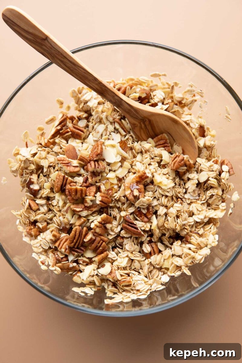 Crunchy Coconut Granola Recipe for Homemade Morning Boost 3 coconut granola ingredients combined in mixing bowl