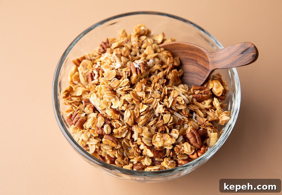 Crunchy Coconut Granola Recipe for Homemade Morning Boost 9 serving bowl of homemade granola with coconut, almonds, and pecans