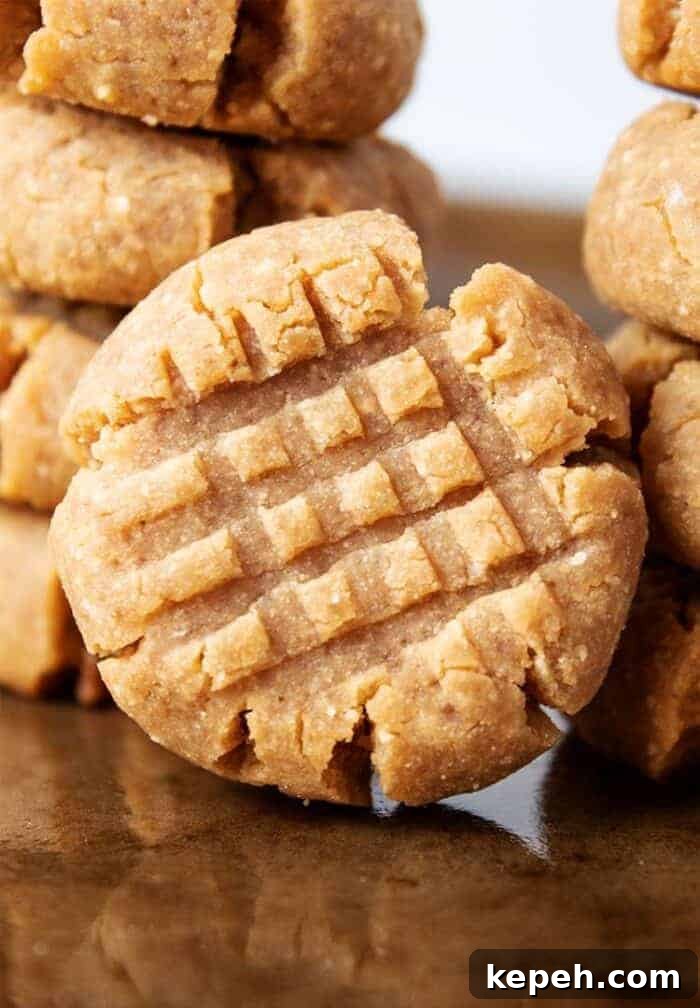 Keto Snickerdoodle Cookies: Low-Carb Cinnamon Treats 13 stack of keto peanut butter cookies on cookie sheet