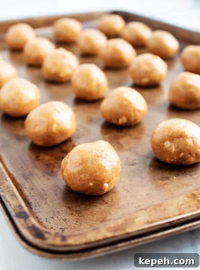 Keto Snickerdoodle Cookies: Low-Carb Cinnamon Treats 22 3 ingredient peanut butter balls lined up on a baking tray