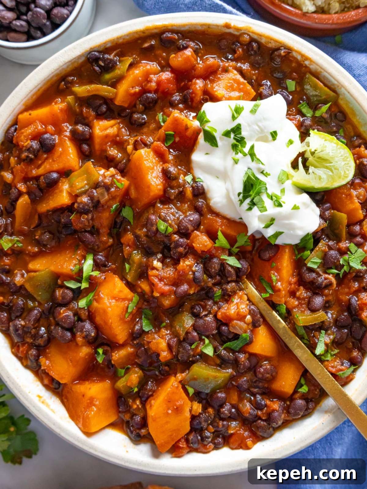 30-Minute Black Bean Chili: Low-Fat, Flavorful Weeknight Recipe 2 Healthy black bean chili served in a bowl with lime rice and Greek yogurt.