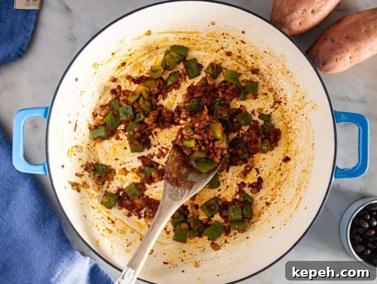 30-Minute Black Bean Chili: Low-Fat, Flavorful Weeknight Recipe 10 Step 1 image – Sautéing onion, bell pepper, garlic, and spices for the black bean chili base.