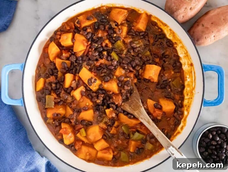 30-Minute Black Bean Chili: Low-Fat, Flavorful Weeknight Recipe 12 Step 3 image – Simmering the chili until sweet potatoes are tender and flavors combine.