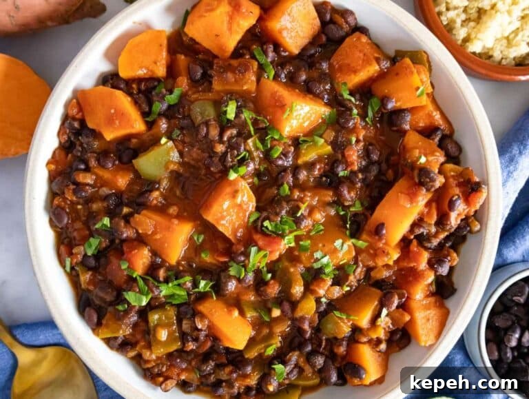 30-Minute Black Bean Chili: Low-Fat, Flavorful Weeknight Recipe 13 Step 4 image – Serving this healthy black bean chili in a hand-made rustic bowl.