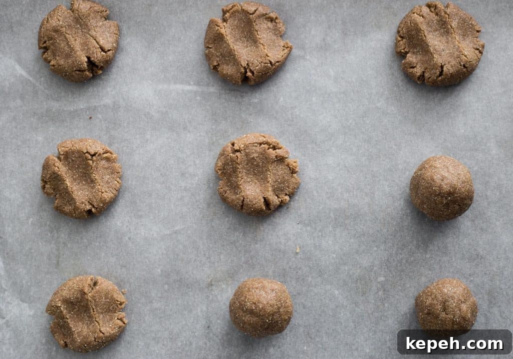 Crispy Ginger Biscuits Without Gluten: Tangy Spice Cookies 8 ginger biscuits on a baking tray ready to be baked