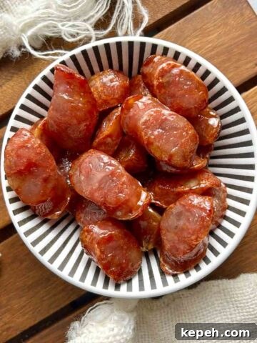 overhead shot of air-fried Chinese sausages in bowl.
