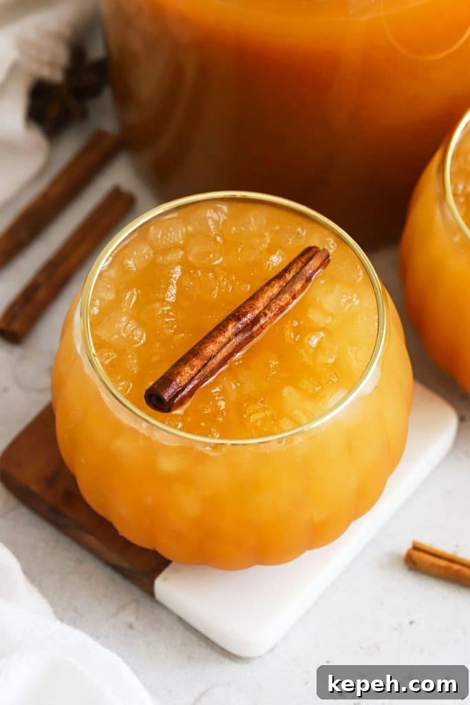 pumpkin shaped glasses of pumpkin juice