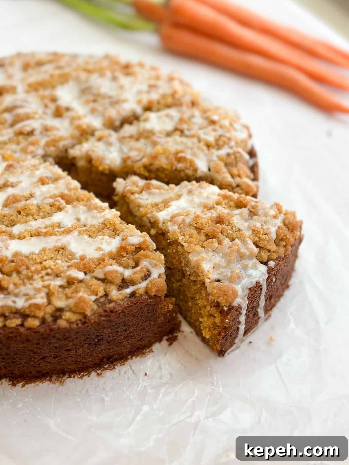 Moist Carrot Coffee Cake with Cream Cheese Glaze 2 a piece of carrot cake coffee cake coming out from the whole cake.