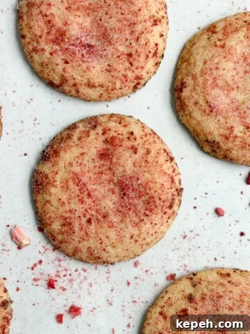 strawberry doodle cookies on a cookie sheet.
