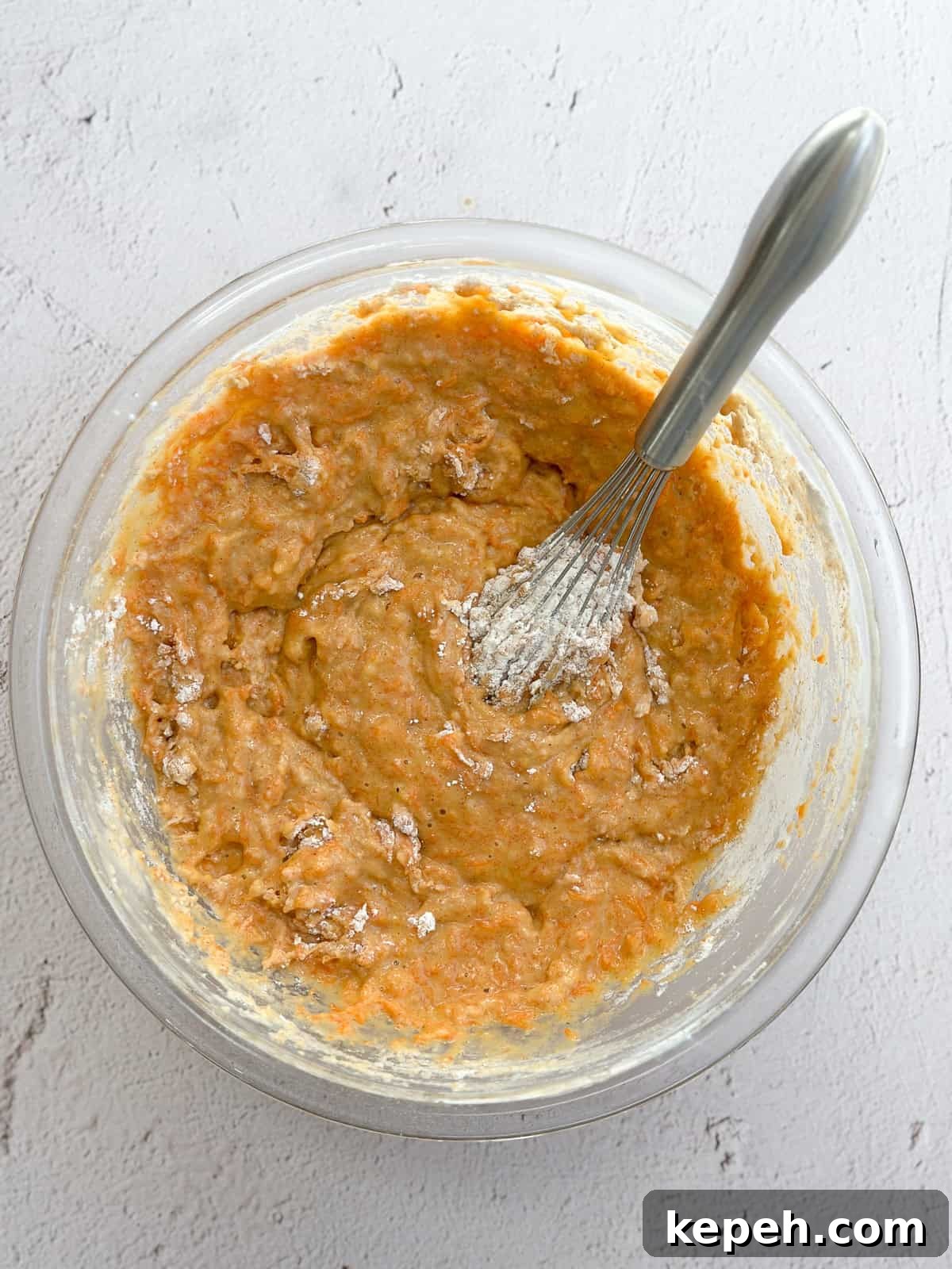 Moist Carrot Coffee Cake with Cream Cheese Glaze 6 mixing in the dry ingredients with a whisk.