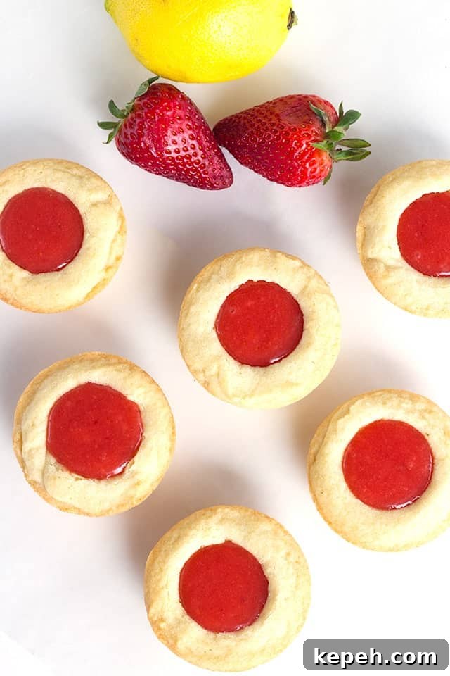 Strawberry Lemon Sugar Cookie Cups Recipe — Refreshing Dessert Cups 3 Strawberry Lemon Sugar Cookie Cups - tender sugar cookies baked in a cupcake tin. They're filled with a sweet and tangy strawberry lemon curd and make the perfect summertime cookie!