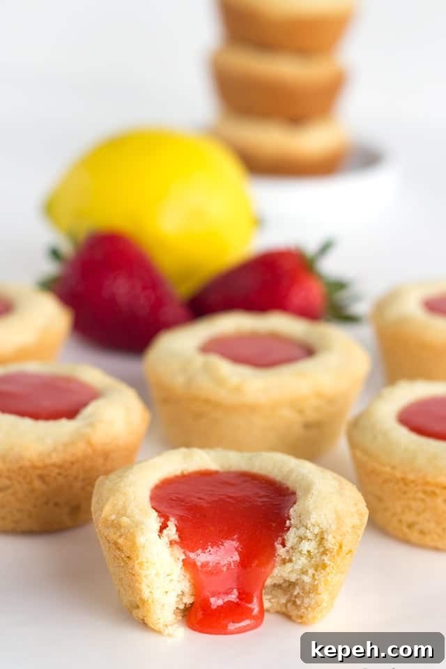 Strawberry Lemon Sugar Cookie Cups Recipe — Refreshing Dessert Cups 4 Strawberry Lemon Sugar Cookie Cups - tender sugar cookies baked in a cupcake tin. They're filled with a sweet and tangy strawberry lemon curd and make the perfect summertime cookie!