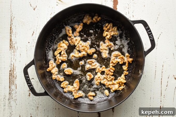 Roasted Butternut Squash Pasta with Sage and Parmesan 5 Skillet with toasted walnuts swirled in melted butter and olive oil.