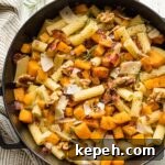 Roasted Butternut Squash Pasta with Sage and Parmesan 10 Roasted butternut squash pasta with rosemary and bacon in a skillet.