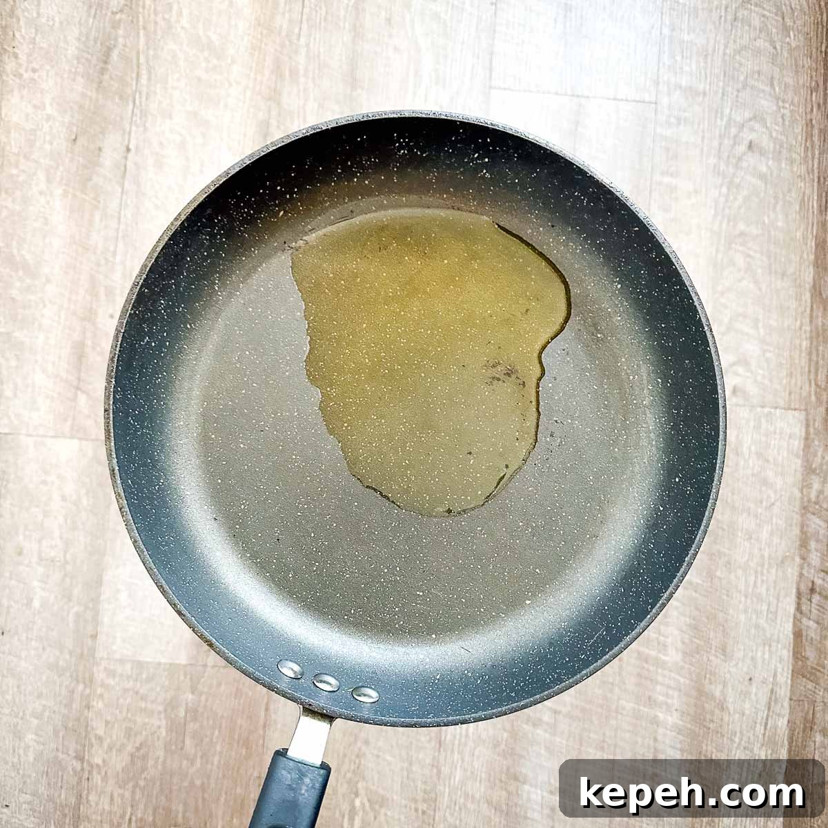 Cajun Blackened Chicken Tenders Recipe with Crispy Pan-Seared Flavor 5 A frying pan with a drop of oil in it.