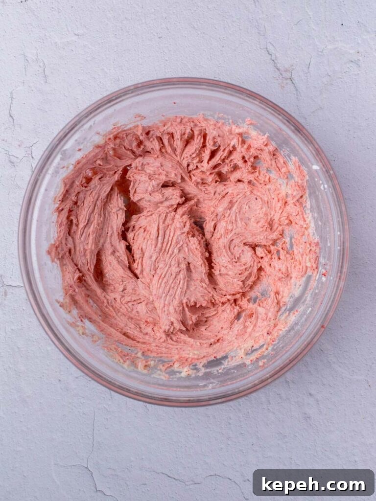 Strawberry Macaron Recipe: Light, Tangy French Cookies 4 Pink meringue in a bowl.