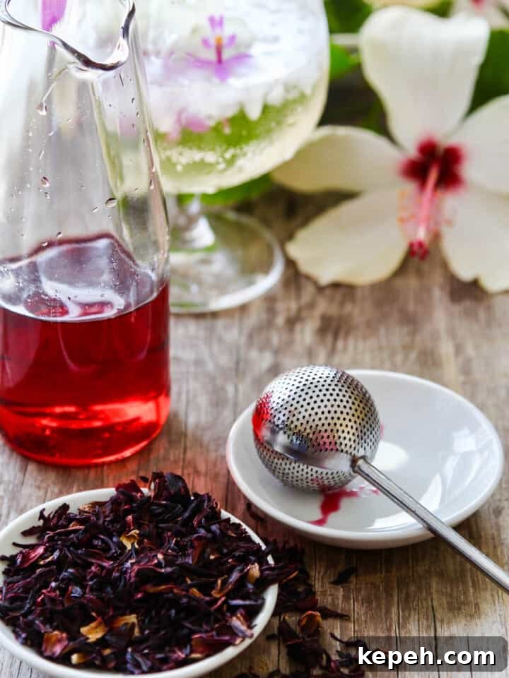 Making hibiscus tea using tea and hot water.