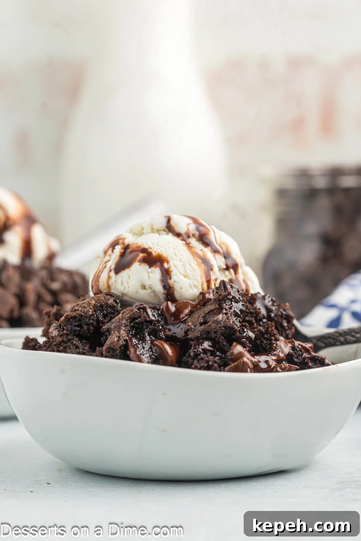Simple Chocolate Dump Cake Recipe — Quick One-Bowl Dessert 2 Bowl of cake topped with ice cream.
