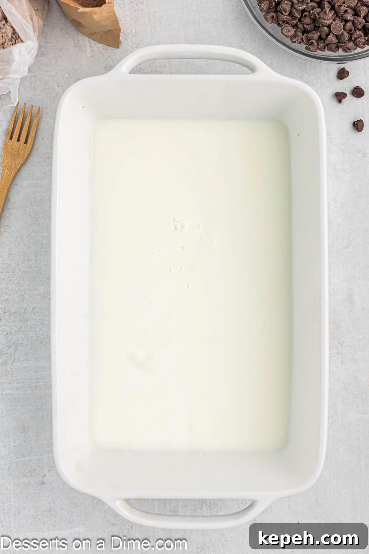 Simple Chocolate Dump Cake Recipe — Quick One-Bowl Dessert 4 Baking dish with milk.