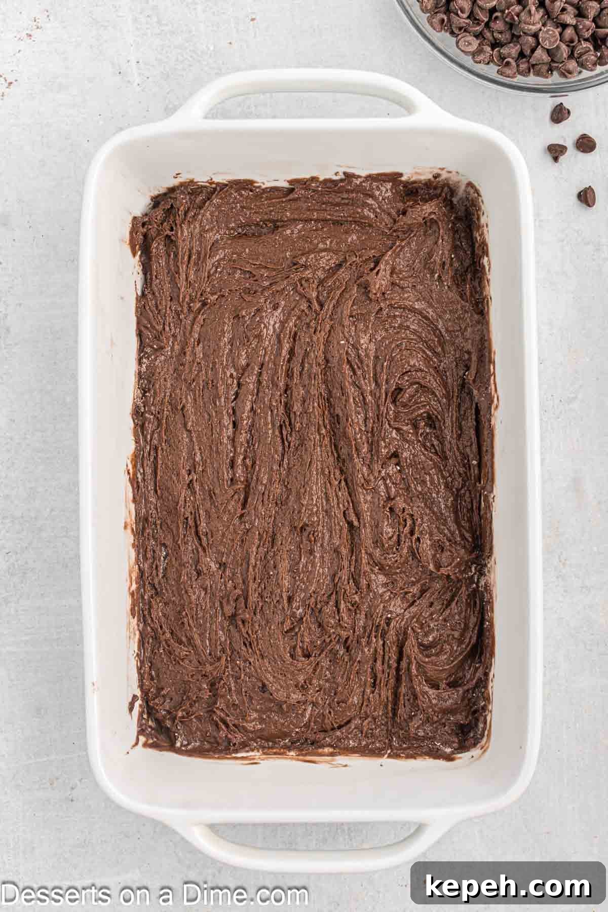 Simple Chocolate Dump Cake Recipe — Quick One-Bowl Dessert 5 Baking dish with cake mix on top.