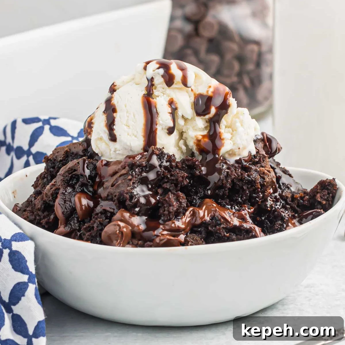 Simple Chocolate Dump Cake Recipe — Quick One-Bowl Dessert 9 Chocolate dump cake in a bowl with ice cream.