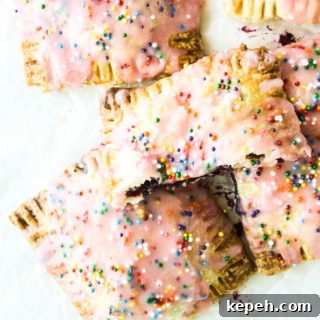 Buttery, flaky pop tarts with blueberry filling and tangy lemon glaze