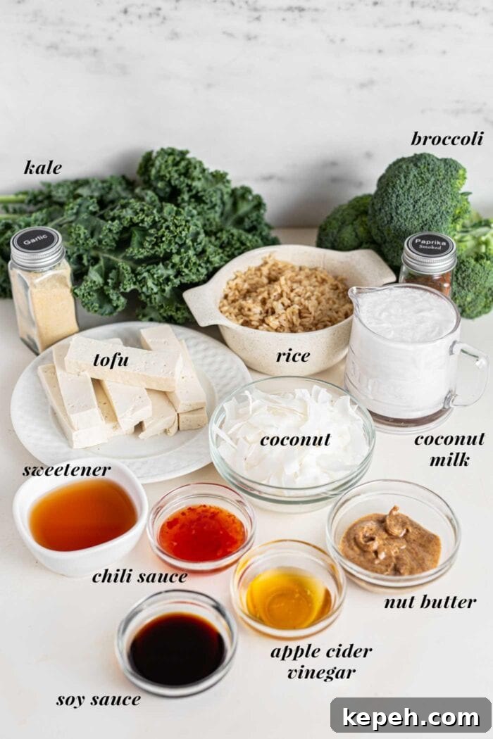 Crispy Tofu and Broccoli Rice Bowl with Sesame-Ginger Sauce 3 Kale, broccoli, rice, coconut milk and various sauces in bowls on a countertop.