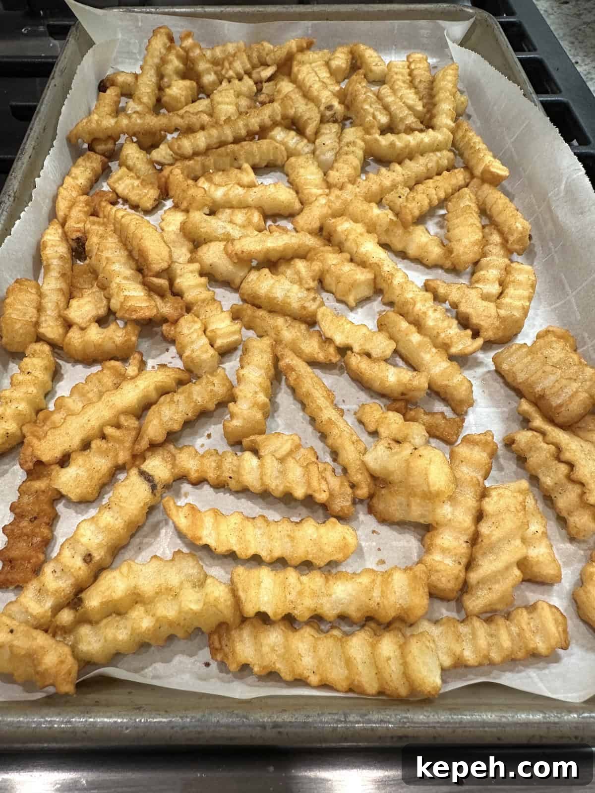 How to Make Authentic French Tacos at Home 6 French fries on a baking sheet.
