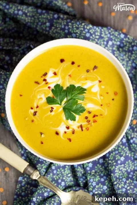 Curried Coconut Lentil Soup with Warm Aromatic Spices 5 curried coconut lentil soup in a bowl with parsley and chilli flakes on top