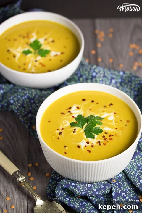 Curried Coconut Lentil Soup with Warm Aromatic Spices 6 curried coconut lentil soup in a bowl with parsley and chilli flakes on top