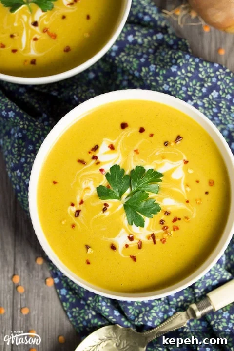 Curried Coconut Lentil Soup with Warm Aromatic Spices 11 curried coconut lentil soup in a bowl with parsley and chilli flakes on top