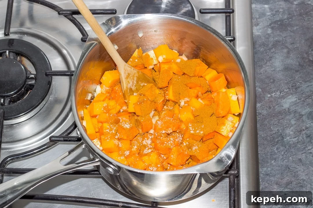 Curried Coconut Lentil Soup with Warm Aromatic Spices 16 lentil soup ingredients in a large pot on the hob