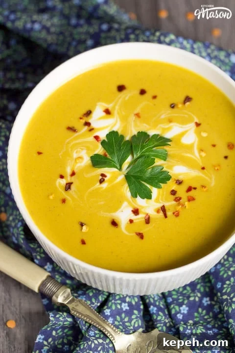 Curried Coconut Lentil Soup with Warm Aromatic Spices 2 curried coconut lentil soup in a bowl with parsley and chilli flakes on top