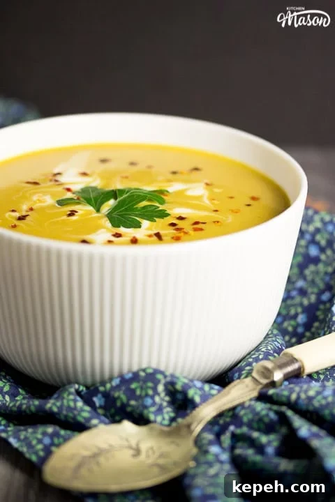 Curried Coconut Lentil Soup with Warm Aromatic Spices 3 curried coconut lentil soup in a bowl with parsley and chilli flakes on top