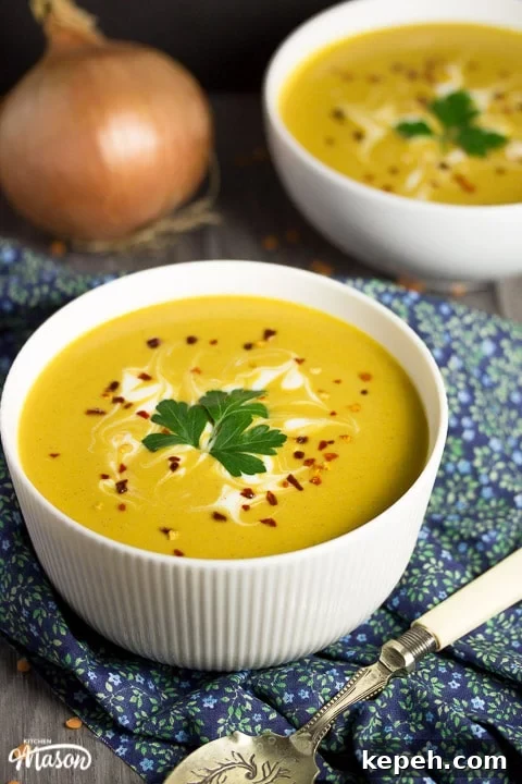 Curried Coconut Lentil Soup with Warm Aromatic Spices 4 curried coconut lentil soup in a bowl with parsley and chilli flakes on top
