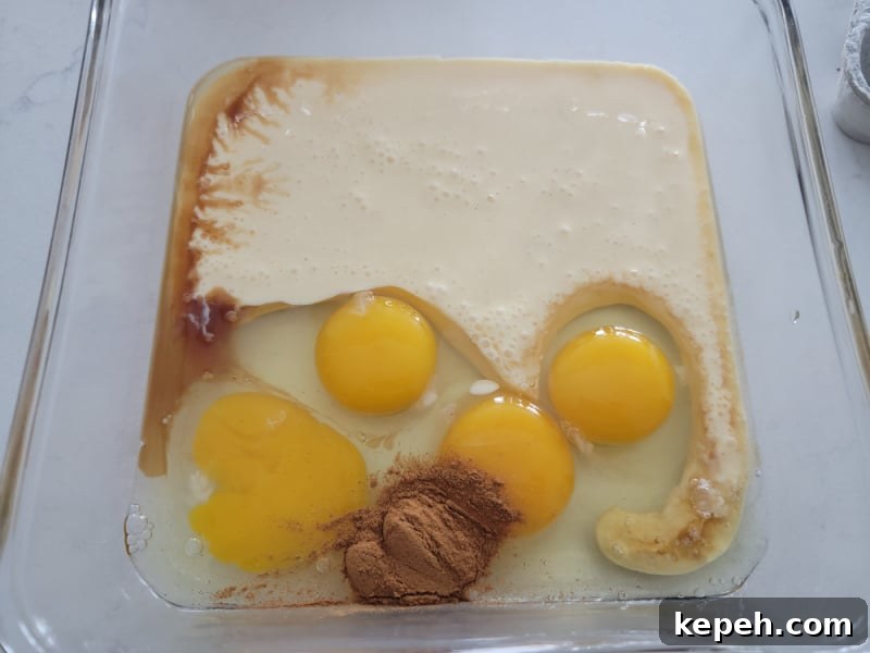 Eggnog French Toast Recipe with Video Tutorial 4 Eggnog French Toast ingredients in a glass pan