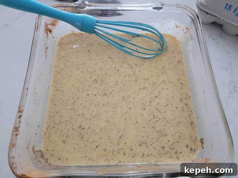 Eggnog French Toast Recipe with Video Tutorial 5 Eggnog french toast coating in a pan