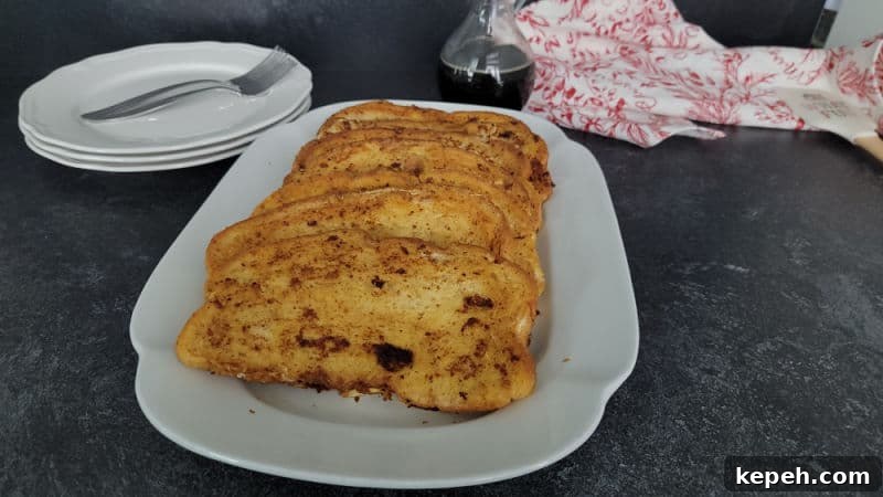 Eggnog French Toast Recipe with Video Tutorial 8 Slices of Eggnog French Toast on a white platter