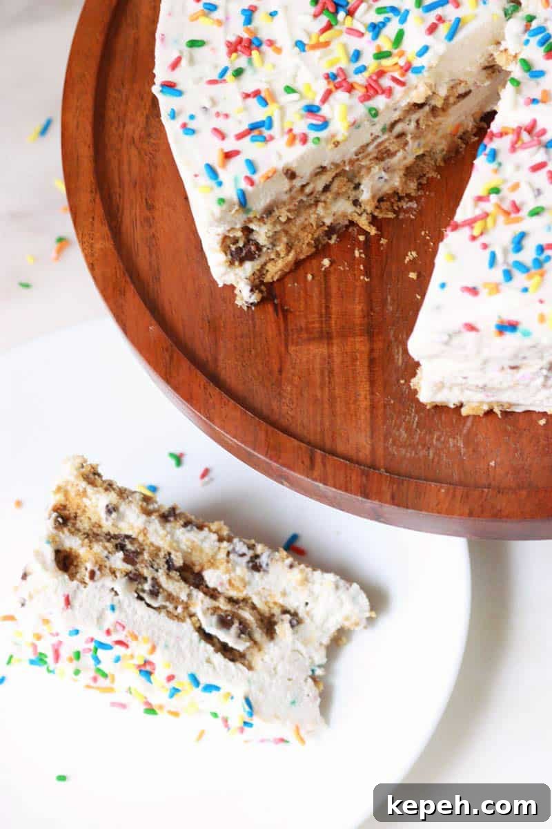 Gluten-Free Funfetti Icebox Cake Recipe for Celebrations 2 a slice of funfetti ice box cake laying on a white plate next to the remaining cake that is set on a wooden cake stand