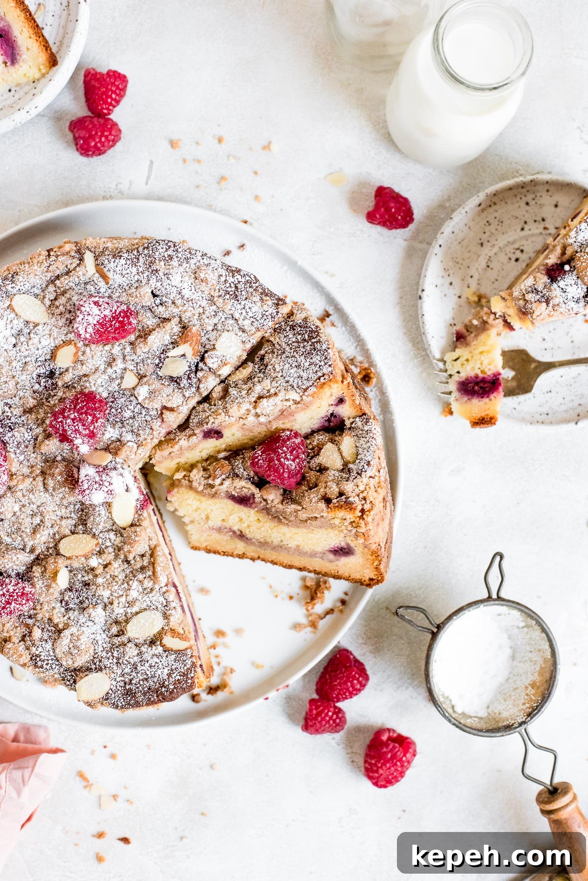 Raspberry Crumb Coffee Cake Recipe – Moist Summer Dessert 3 close up top of coffee cake being sliced