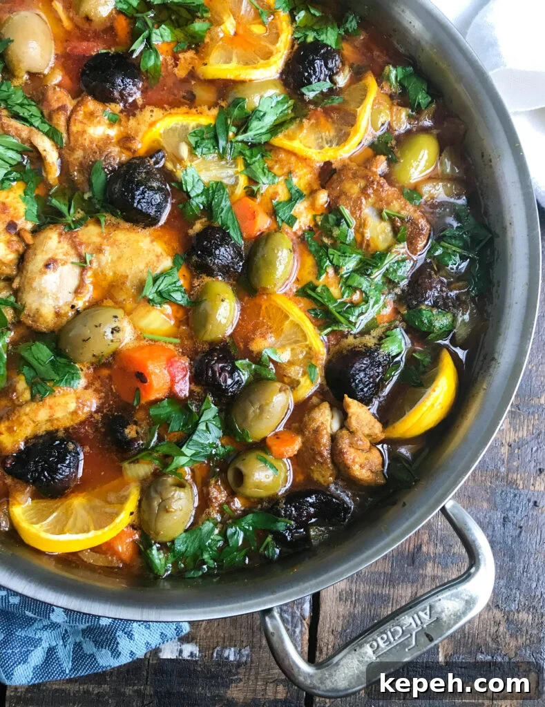 Moroccan-Spiced Chicken Thighs with Citrus and Olives 2 Moroccan Chicken Thighs in Silver Pan